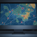 Close-up of a stylized digital map with survey layers on a monitor