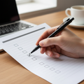 Close-up of a hand checking off boxes on a printed checklist