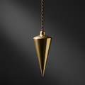Polished brass plumb bob hanging from a string against a dark neutral background, dramatic light